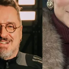 Piotr Kędzierski z żoną, uśmiechnięty mężczyzna w okularach i fragment twarzy kobiety w futrze.
