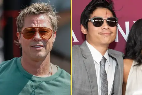 Brad Pitt w okularach i Pax Thien Jolie Pitt w garniturze, uśmiechnięty, obok kobiety.