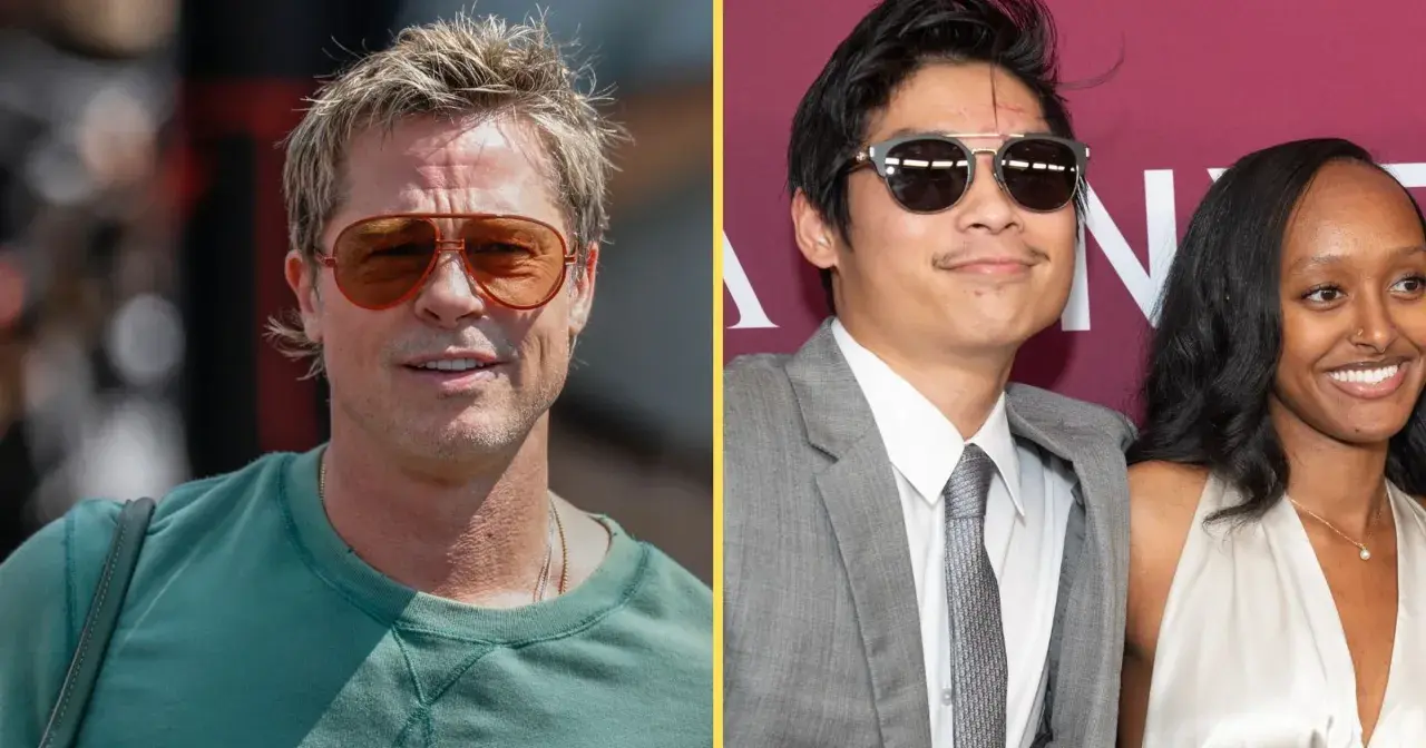 Brad Pitt w okularach i Pax Thien Jolie Pitt w garniturze, uśmiechnięty, obok kobiety.