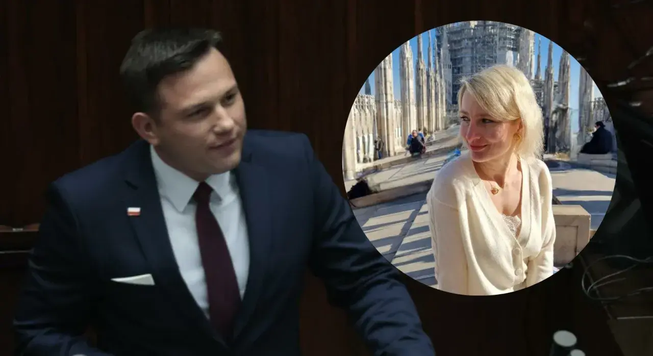Sławomir Mentzen w garniturze i jego żona uśmiechają się na tle katedry.